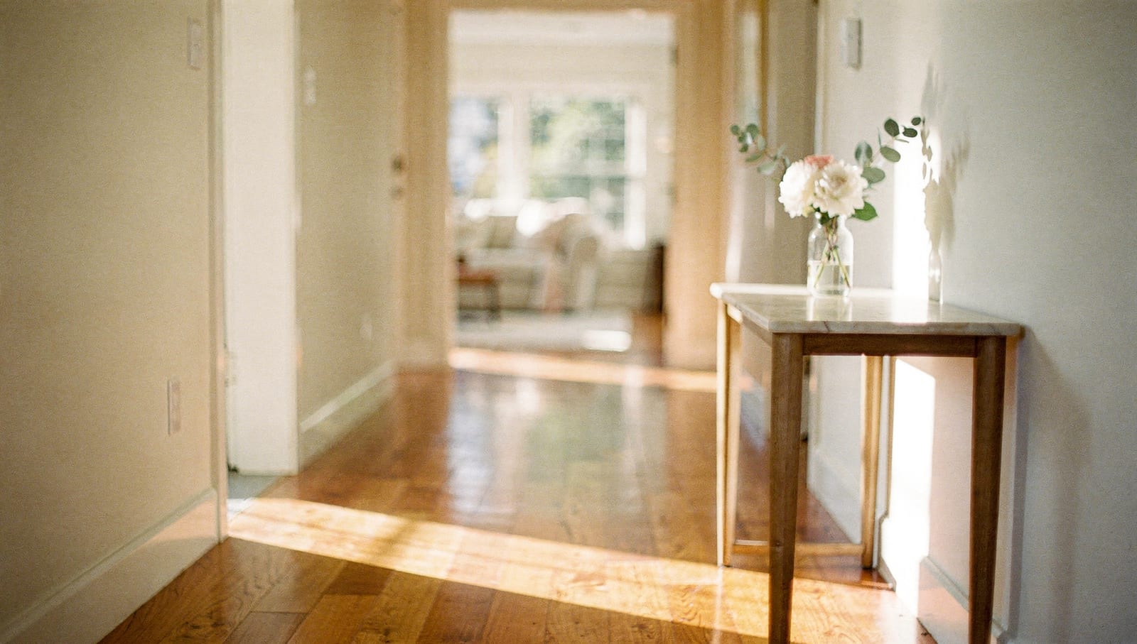 Morning light falling across the gleaming hardwood floors of a freshly cleaned home